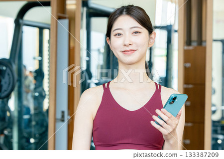 Training gym app young woman Training gym app young woman 133387209