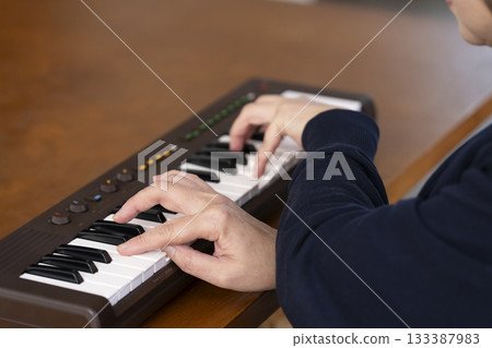 Senior woman playing keyboard Senior woman playing keyboard 133387983