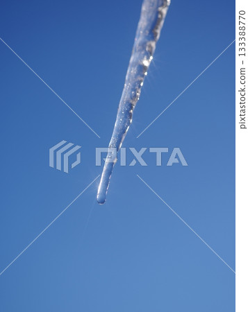 A single icicle hanging from the sky A single icicle hanging from the sky 133388770