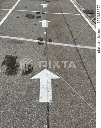 White Arrows on Asphalt Pavement 133388771