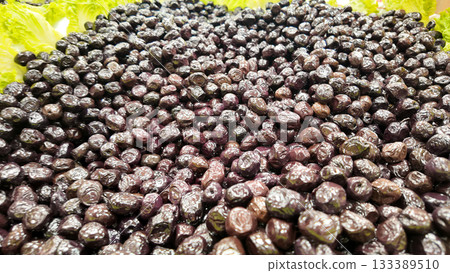 Fresh olives displayed at a local market in daytime Fresh olives displayed at a local market in daytime 133389510
