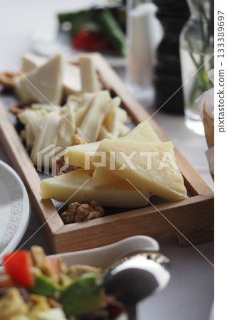 Delicious cheese platter served at a restaurant table 133389697