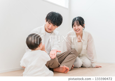 Parents and children playing with their babies in the living room, family, couple Parents and children playing with their babies in the living room, family, couple 133390472