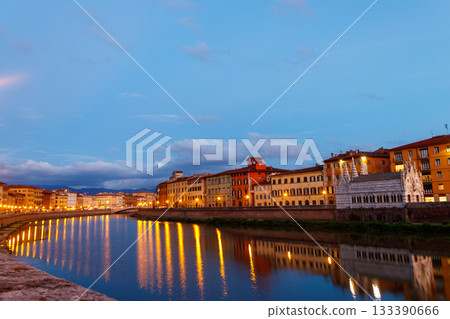 Panoramic view of the old town of Pisa and the Arno river at twilight, Italy. Night cityscape Panoramic view of the old town of Pisa and the Arno river at twilight, Italy. Night cityscape 133390666
