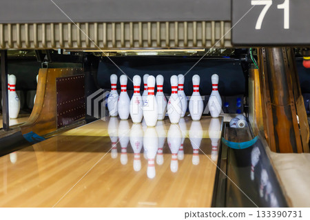 Bowling pins lined up waiting for a game Bowling pins lined up waiting for a game 133390731