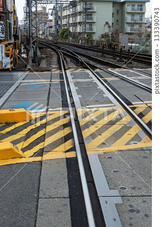 Railroad crossing structure and safety measures: Yellow and black paint on the railroad crossing 133390743