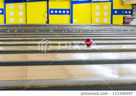 A ball running down a bowling lane A ball running down a bowling lane 133390897