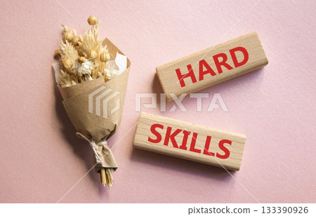 Hard skills symbol. Wooden blocks with words Hard skills. Beautiful pink background with bouquet of flowers. Business and Hard skills concept. Copy space. Hard skills symbol. Wooden blocks with words Hard skills. Beautiful pink background with bouquet of flowers. Business and Hard skills concept. Copy space. 133390926