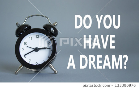 Do you have a Dream symbol. Beautiful grey background with alarm clock. Business and Do you have a Dream concept. Copy space. Do you have a Dream symbol. Beautiful grey background with alarm clock. Business and Do you have a Dream concept. Copy space. 133390976
