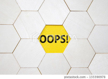 Oops symbol. Concept word Oops on wooden comb puzzle. Beautiful yellow background. Business and Oops concept. Copy space. 133390978
