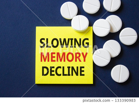 Slowing Memory Decline symbol. Concept words Slowing Memory Decline on yellow note. Beautiful deep blue background with pills. Healthcare and Slowing Memory Decline concept. Copy space. Slowing Memory Decline symbol. Concept words Slowing Memory Decline on yellow note. Beautiful deep blue background with pills. Healthcare and Slowing Memory Decline concept. Copy space. 133390983