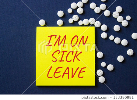 Sick leave symbol. Concept word I am on sick leave on yellow note. Beautiful deep blue background with pills. Medicine and I am on sick leave concept. Copy space Sick leave symbol. Concept word I am on sick leave on yellow note. Beautiful deep blue background with pills. Medicine and I am on sick leave concept. Copy space 133390991