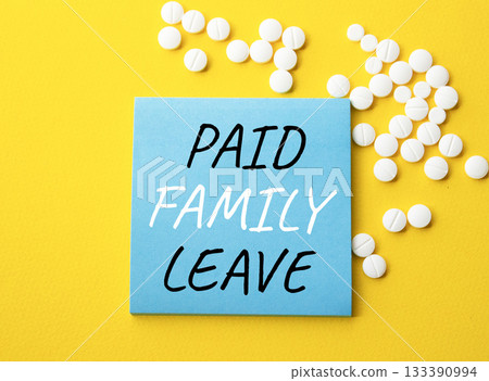 Paid Family Leave symbol. Concept words Paid Family Leave on blue note. Beautiful yellow background with pills. Healthcare and Paid Family Leave concept. Copy space. Paid Family Leave symbol. Concept words Paid Family Leave on blue note. Beautiful yellow background with pills. Healthcare and Paid Family Leave concept. Copy space. 133390994