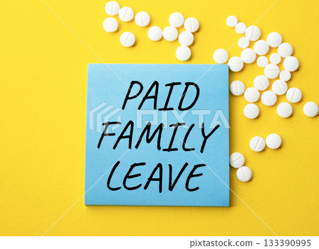Paid Family Leave symbol. Concept words Paid Family Leave on blue note. Beautiful yellow background with pills. Healthcare and Paid Family Leave concept. Copy space. Paid Family Leave symbol. Concept words Paid Family Leave on blue note. Beautiful yellow background with pills. Healthcare and Paid Family Leave concept. Copy space. 133390995