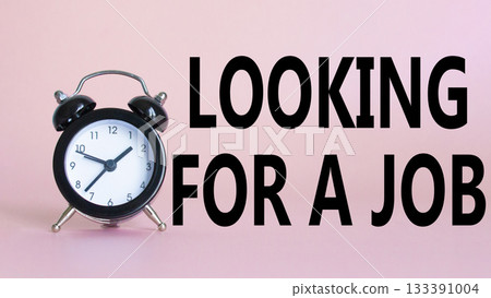 Looking for a job symbol. Beautiful pink background with alarm clock. Business and Looking for a job concept. Copy space. 133391004