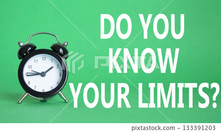 Do You Know Your Limits symbol. Beautiful green background with alarm clock. Business and Do You Know Your Limits concept. Copy space. 133391203