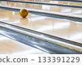 A ball running down a bowling lane 133391229