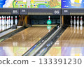 The moment the ball hits the pins at a bowling tournament 133391230