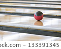 A ball running down a bowling lane 133391345