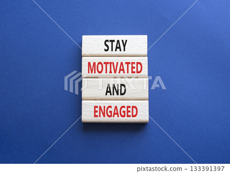 Stay Motivated and Engaged symbol. Concept words Stay Motivated and Engaged on wooden blocks. Beautiful deep blue background. Business concept. Copy space Stay Motivated and Engaged symbol. Concept words Stay Motivated and Engaged on wooden blocks. Beautiful deep blue background. Business concept. Copy space 133391397