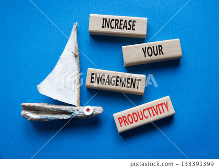 Productivity symbol. Wooden blocks with words Increase your Engagement Productivity. Beautiful blue background with boat. Business concept. Copy space. Productivity symbol. Wooden blocks with words Increase your Engagement Productivity. Beautiful blue background with boat. Business concept. Copy space. 133391399