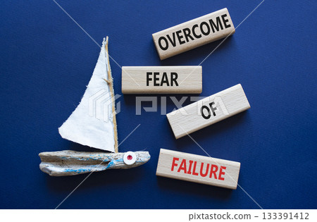 Fear of failure symbol. Concept words Overcome Fear of failure on wooden blocks. Beautiful deep blue background with boat. Business and Fear of failure concept. Copy space. 133391412