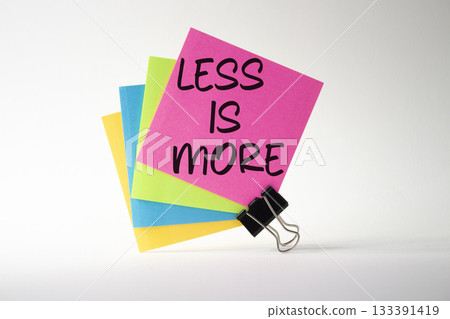 Less is More symbol. Sticky Notes with Concept words Less is More. Beautiful white background. Business and Less is More concept. Copy space. Less is More symbol. Sticky Notes with Concept words Less is More. Beautiful white background. Business and Less is More concept. Copy space. 133391419