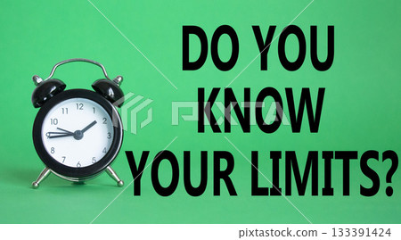 Do You Know Your Limits symbol. Beautiful green background with alarm clock. Business and Do You Know Your Limits concept. Copy space. 133391424