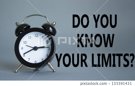 Do You Know Your Limits symbol. Beautiful grey background with alarm clock. Business and Do You Know Your Limits concept. Copy space. 133391431