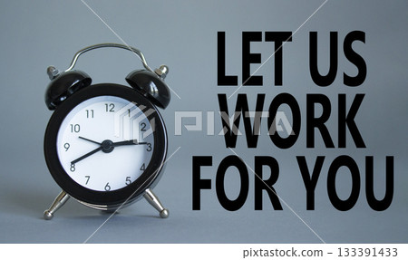 Let us work for you symbol. Beautiful grey background with alarm clock. Business and Let us work for you concept. Copy space. 133391433