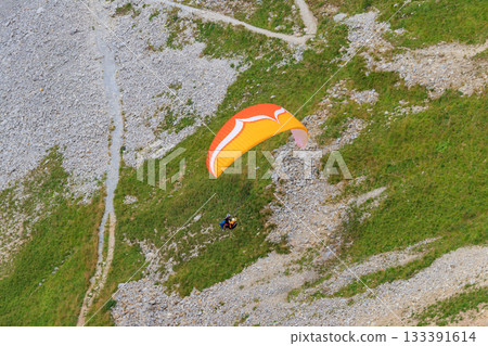 Paragliders flying from Pilatus mountain in Swiss Alps, Switzerland. Concept of active lifestyle and extreme sport adventure Paragliders flying from Pilatus mountain in Swiss Alps, Switzerland. Concept of active lifestyle and extreme sport adventure 133391614