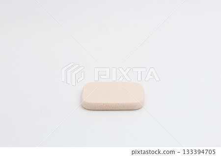 Cosmetic puff for foundation on white background Cosmetic puff for foundation on white background 133394705