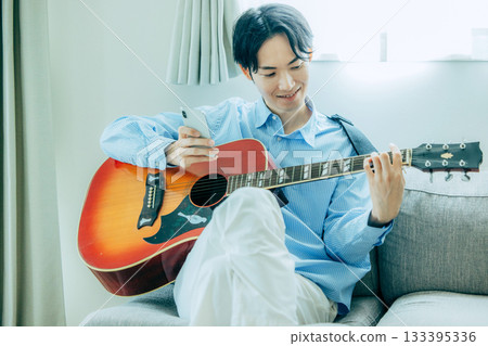 Man playing guitar 133395336