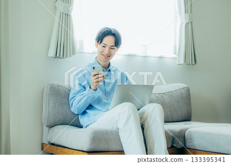 Teleworking middle-aged man 133395341