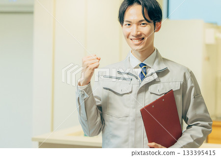 Smiling man in work clothes 133395415