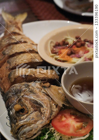 Deep-fried Sea bass with Fish Sauce served on plate 133396190