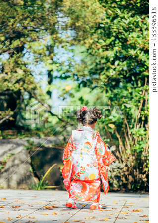 A girl visiting a shrine for Shichi-Go-San A girl visiting a shrine for Shichi-Go-San 133396518