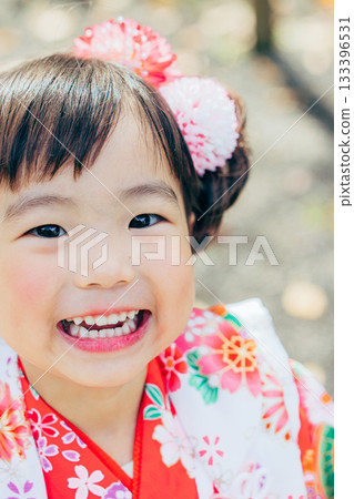 A girl visiting a shrine for Shichi-Go-San A girl visiting a shrine for Shichi-Go-San 133396531