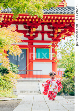 A girl visiting a shrine for Shichi-Go-San A girl visiting a shrine for Shichi-Go-San 133396539