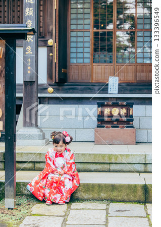 A girl visiting a shrine for Shichi-Go-San A girl visiting a shrine for Shichi-Go-San 133396549