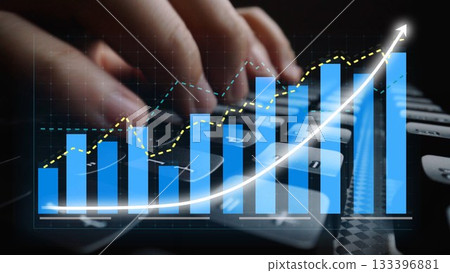 Hands Typing on a Keyboard with Overlaid Data Visualization, Bar Graphs, and Increasing Trendline Indicating Growth and Analysis in Finance or Business Setting Copula 133396881