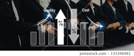 Professional Business Team Analyzing Graphs and Data Trends on Quality and Cost Metrics during a Strategy Meeting in a Modern Office Environment Trope Professional Business Team Analyzing Graphs and Data Trends on Quality and Cost Metrics during a Strategy Meeting in a Modern Office Environment Trope 133396961