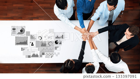 Team Collaboration at a Conference Table with Graphs and Data Visualizations in a Modern Office Setting Trope Team Collaboration at a Conference Table with Graphs and Data Visualizations in a Modern Office Setting Trope 133397091