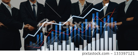 Business professionals in suits analyze market trends with graphs and charts, demonstrating collaboration and financial growth in modern workplace setting Scalp 133397121