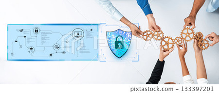 Collaborative Teamwork for Cybersecurity Solutions Featuring Gears, Digital Shield, and Technology Flowchart in Modern Office Setting Trope 133397201