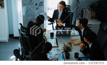 Top view of smart manager compare chart between board and paper. Directorate. 133397372
