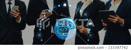 Diverse Business Professionals Collaborating on Digital Technology Solutions with Modern Devices in a Professional Setting Trope Diverse Business Professionals Collaborating on Digital Technology Solutions with Modern Devices in a Professional Setting Trope 133397742