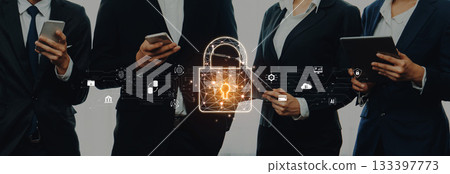 Business people using mobile devices with digital security lock symbol representing data protection, privacy, and technology in modern workplace environment Trope Business people using mobile devices with digital security lock symbol representing data protection, privacy, and technology in modern workplace environment Trope 133397773