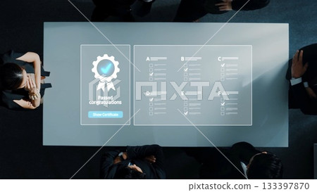 Two Business Professionals Celebrate Achievement with Digital Certificate Displayed on a Modern Conference Table in a Professional Setting. Raster 133397870