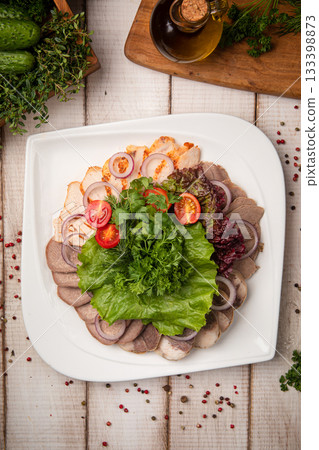 Kazakh sliced meat platter with kazy and zhaya Kazakh sliced meat platter with kazy and zhaya 133398873